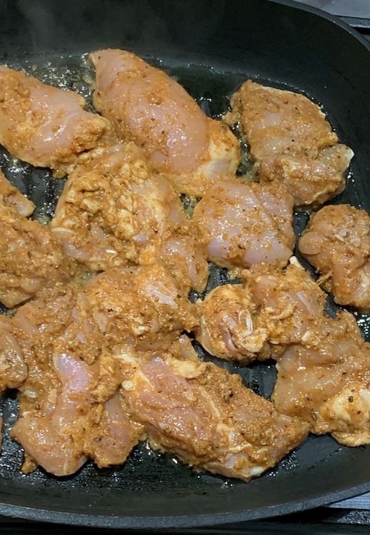 Step 1.1: Once the oil is hot, place the marinated chicken in the pan and sear them from both sides for about 3-4 minutes