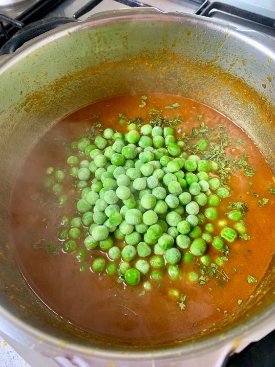 Step 5.1: Add green peas and crushed kasuri methi