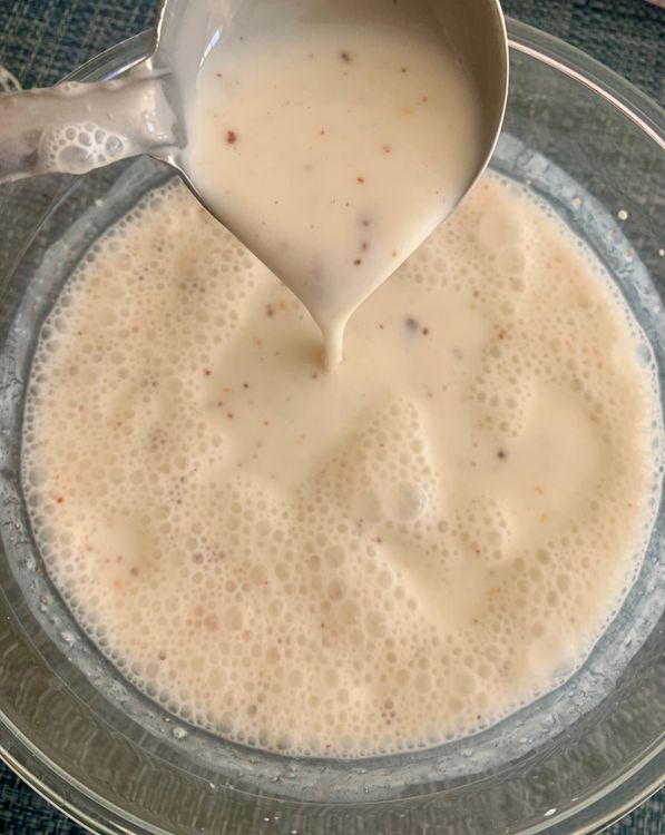 Step 2.1: In a separate bowl, whisk together curd, water, salt, red chilli powder, roasted cumin, and black salt until smooth