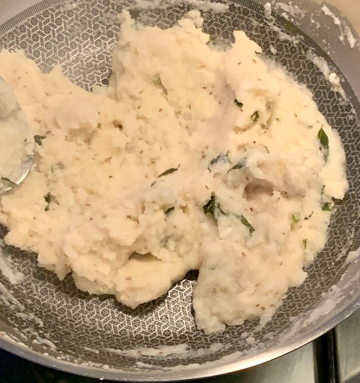 Step 1.4: Combine semolina (suji) and poha into the pan, mixing until they form a slightly sticky dough