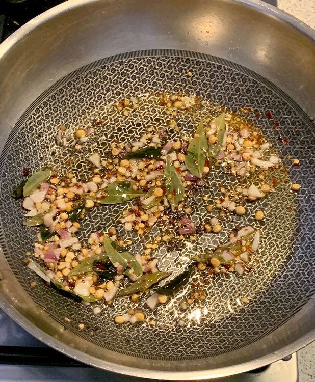 Step 2.1: Add curry leaves and chilli flakes, and stir to combine