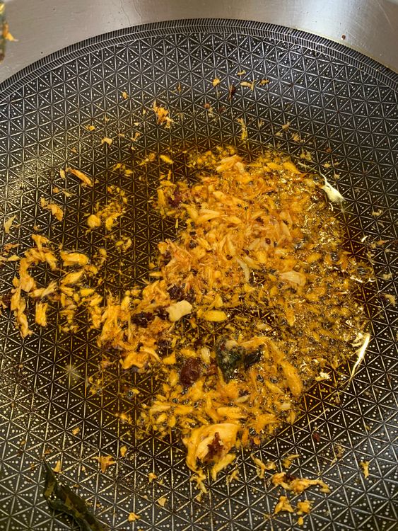 Step 3.1: Sauté crushed garlic in the oil over medium-high