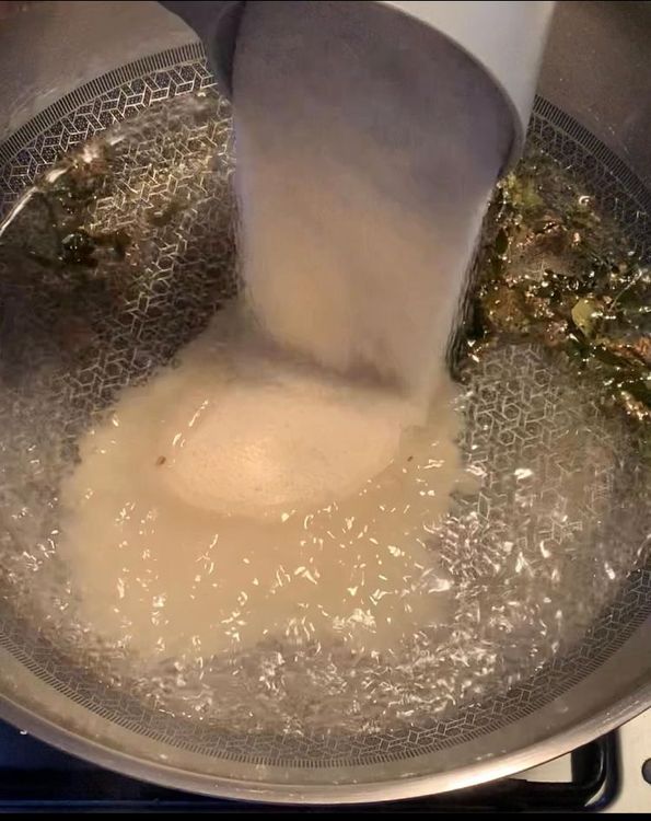 Step 1.1: Combine semolina (suji) and poha into the pan, mixing until they form a slightly sticky dough