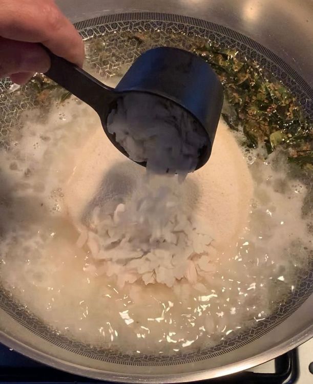 Step 1.2: Combine semolina (suji) and poha into the pan, mixing until they form a slightly sticky dough