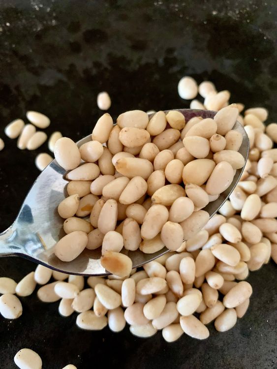 Step 1.1: In a small pan over low heat, toast the pine nuts for 2–3 minutes until golden and fragrant