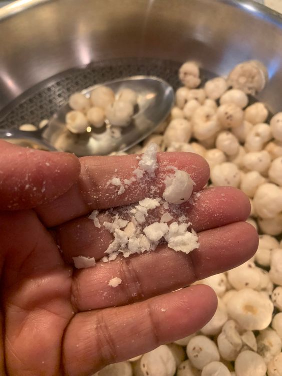 Step 1.1: Add the makhana (foxnuts) and 1 teaspoon of rock salt