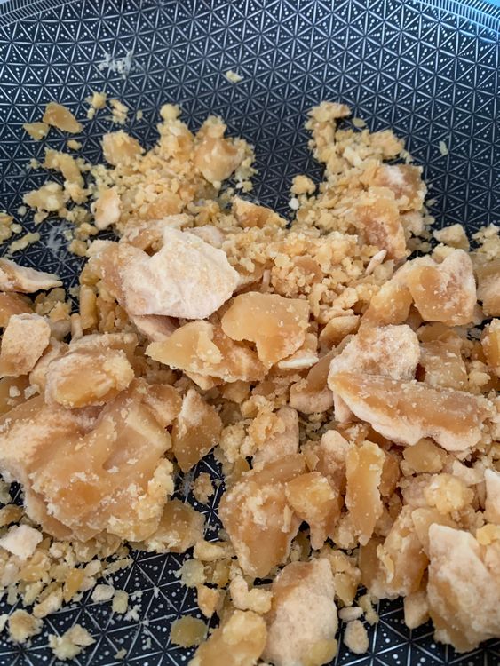 Step 1.1: Melt the jaggery over low heat in a deep pan or karahi, stirring continuously