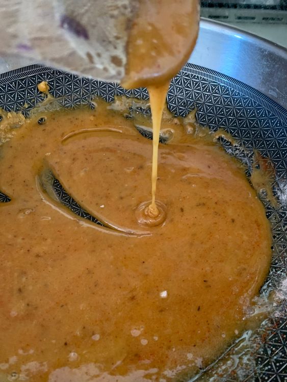 Step 1.2: Add the red chilli powder, black salt and roasted cumin powder to the melted jaggery and cook for a minute