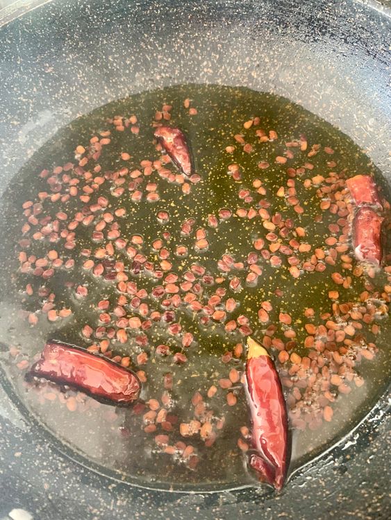 Step 4.1: Add dry red chillies and sauté for a few seconds
