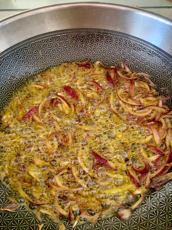 Step 3.2: Add sliced onions and sauté until golden brown