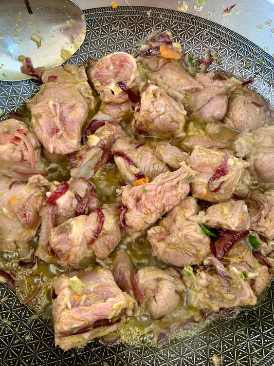 Step 3.2: Add the mutton pieces along with the garlic-chilli paste