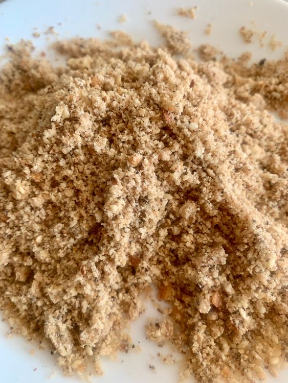 Step 2.1: Coarsely grind the roasted coconut, seeds, and peanuts together