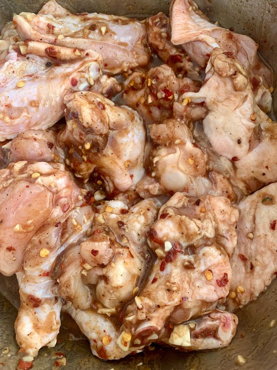 Step 1.1: Add the chicken wings to the marinade, ensuring they are evenly coated