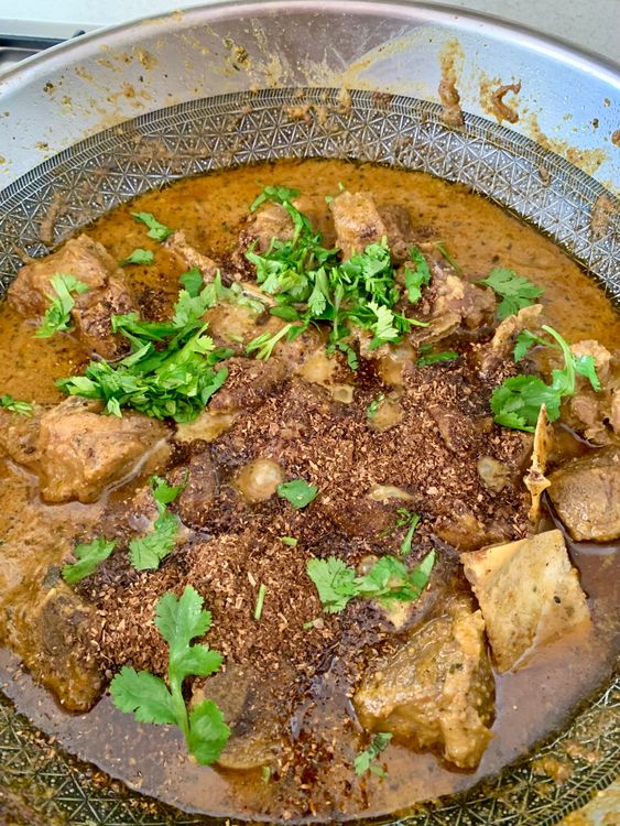 Step 3.1: Add the coarsely ground cumin-coriander mix and chopped coriander leaves