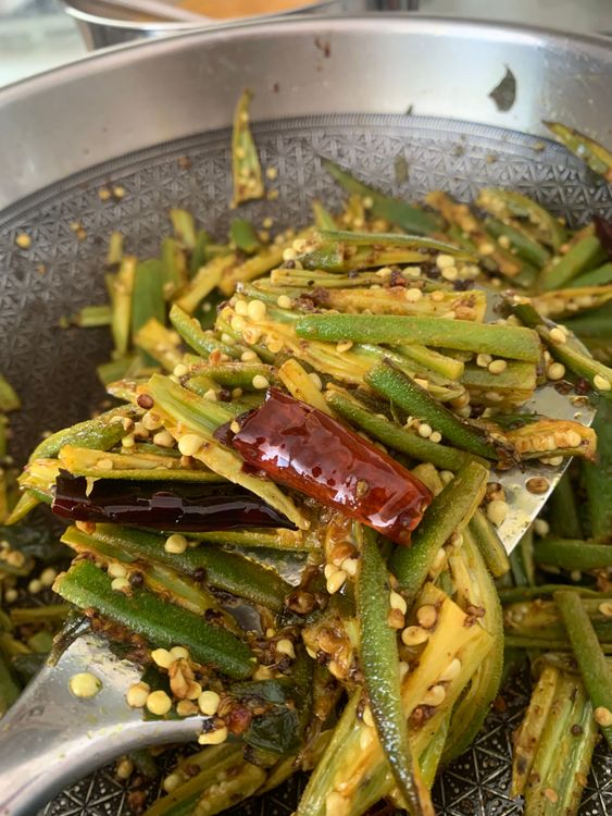 Step 2.1: Add the seasoned okra to the skillet, drizzle with lemon juice, and stir well