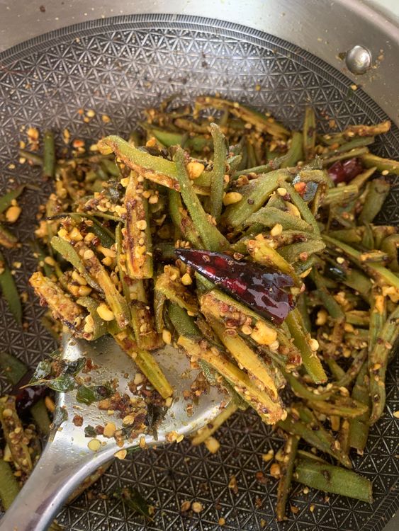 Step 2.2: Sprinkle the prepared peanut-spice mixture over the okra, mixing thoroughly