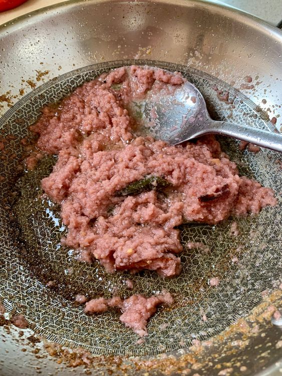 Step 3.2: Add ginger-garlic paste and sauté until the raw smell fades