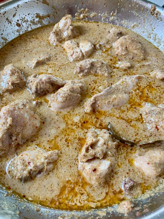 Step 3.1: Pour in hot water, mix well, cover, and cook until the chicken becomes soft and tender