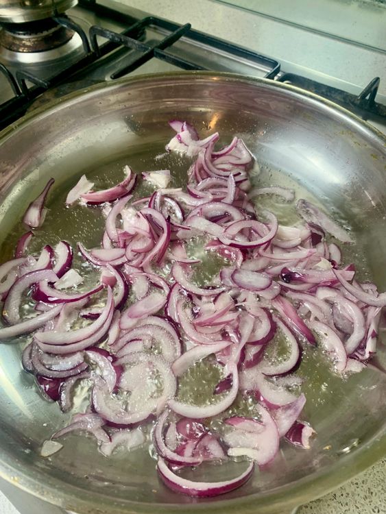 Step 3.1: Heat oil in a flat pan and fry onions until golden