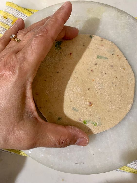 Step 1.2: Roll out each dough ball into a flat circle about 3-4 inches in diameter