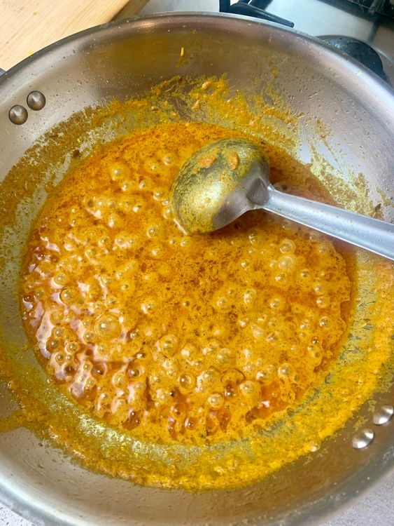 Step 1.1: Once the mixture comes together and starts separating oil again, add the remaining water and bring to a gentle boil