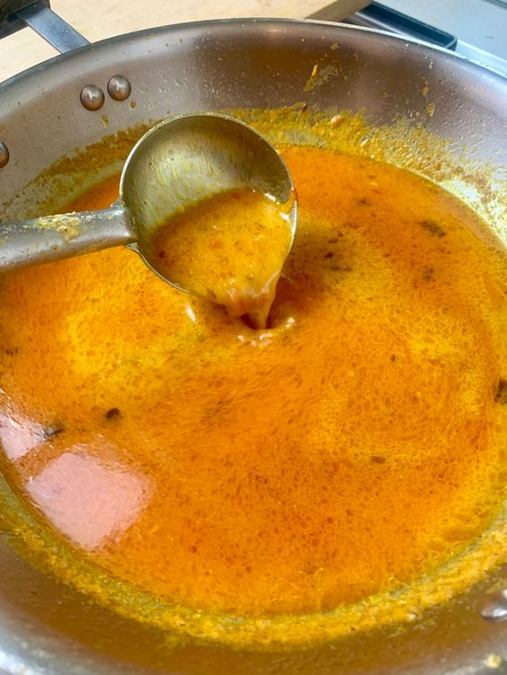 Step 1.2: Once the mixture comes together and starts separating oil again, add the remaining water and bring to a gentle boil