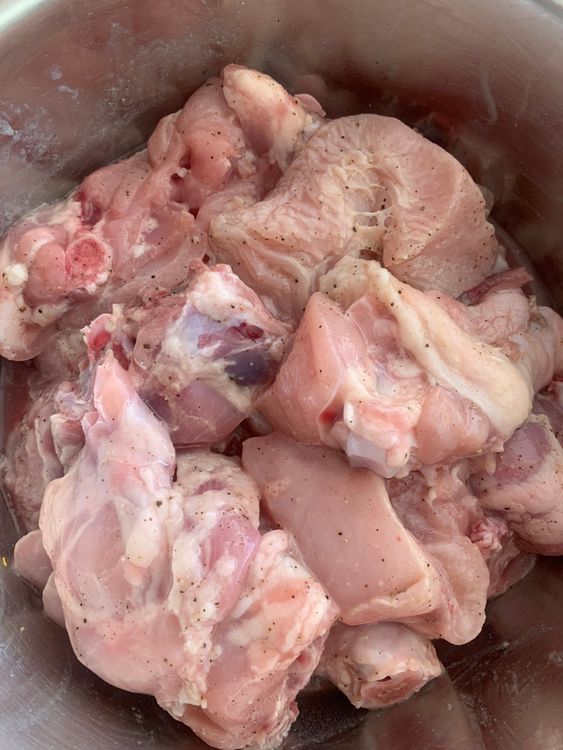 Step 1.1: In a bowl, combine chicken pieces with lemon juice, salt, and black pepper powder