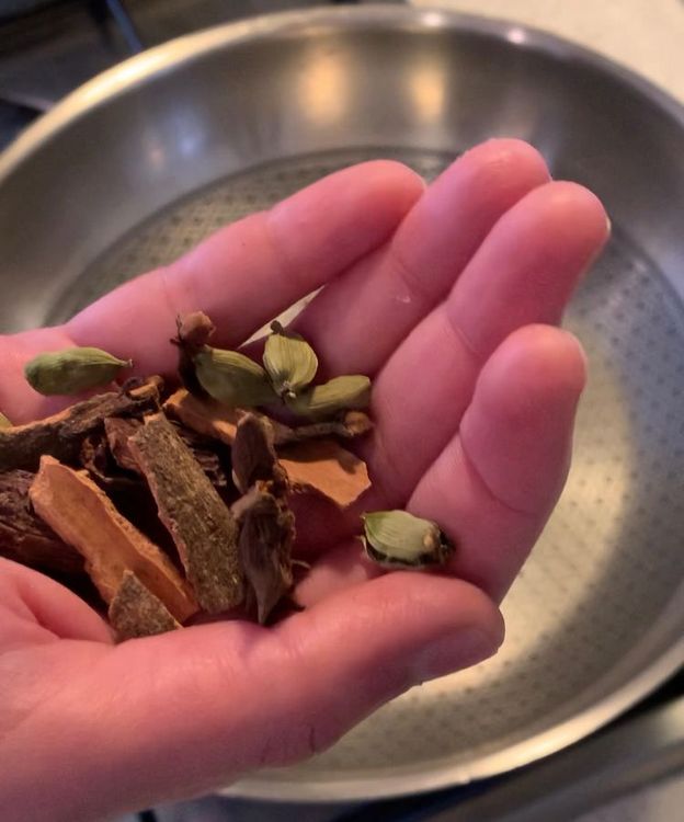 Step 1.1: Heat a pan and dry roast the black and green cardamoms, bay leaf, star anise, cloves, and cinnamon until they release their aromatic fragrance