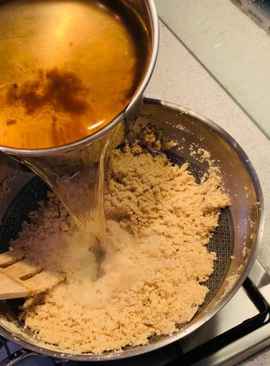 Step 1.1: Carefully add the hot spiced water to the pan (Remove the whole spices from the water before adding)