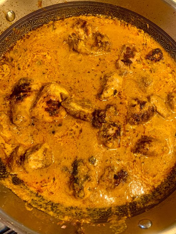 Step 4.1: Return the cooked chicken to the kadhai, mixing well to ensure each piece is well-coated with the gravy