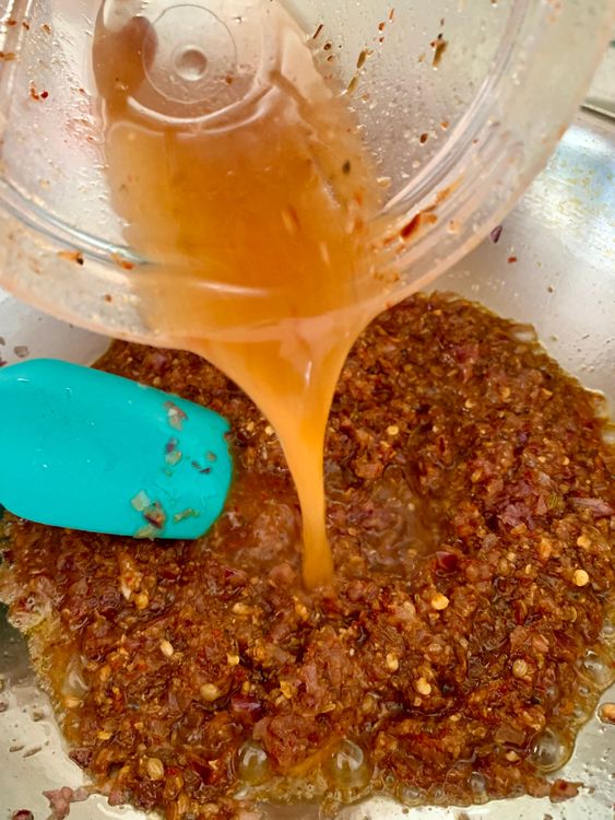 Step 3.2: Add the masala paste and masala rinse water and cook until the ghee separates