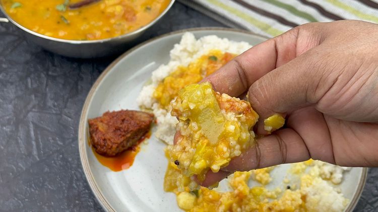 Step 6.3: Add the tempering to the cooked dal