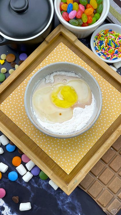 Step 1.1: Add milk, melted butter (or oil), and vanilla extract to the dry ingredients