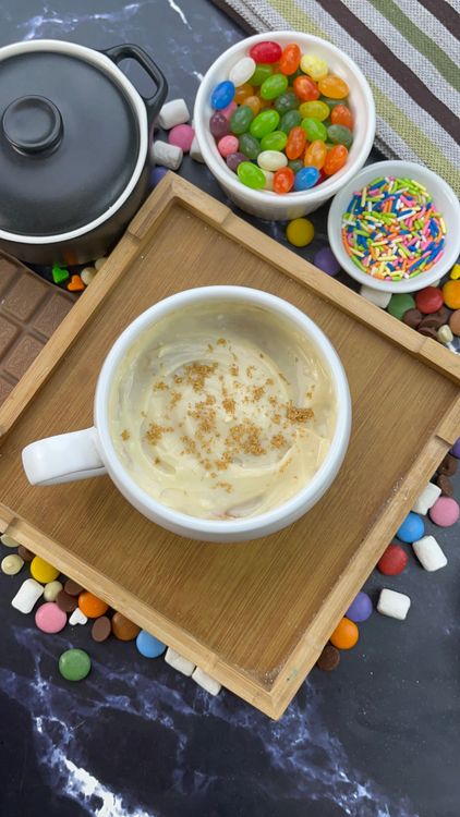 Step 5.1: Spread it over the cooled mug cake