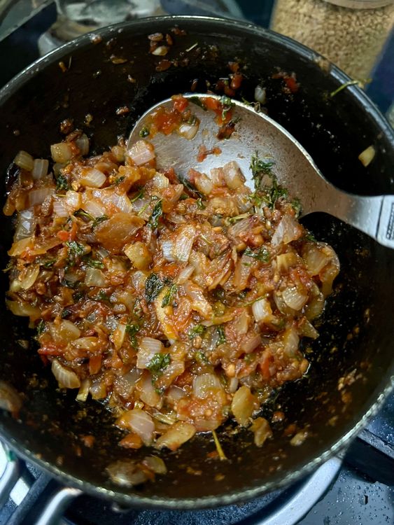 Step 3.2: Add the chopped onions and sauté until slightly brown, followed by the chopped tomatoes until soft