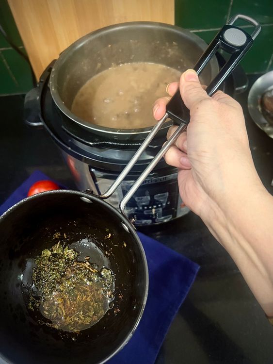 Step 4.1: Mix the final tadka into the dal, reserving some for garnish