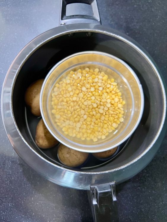Step 1.1: Boil the lentils along with the potatoes in a separate container in a pressure cooker for about 20 minutes