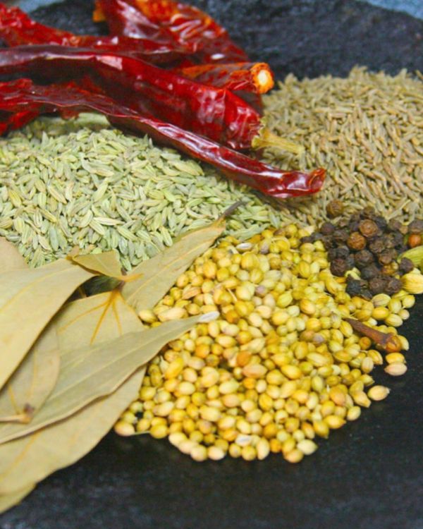 Step 1.1: Dry roast coriander seeds, fennel seeds, cumin seeds, bay leaves, dry red chillies, black pepper corns, and cloves on low flame for 5-7 minutes