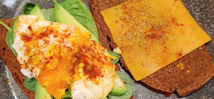 Step 1.1: Meanwhile, heat a separate skillet over medium-low heat, coat with coconut oil cooking spray, and add the organic eggs, keeping them separate from one another if possible