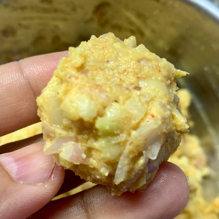 Step 2.1: Take small portions of the fritter mixture and shape it into lemon-sized balls
