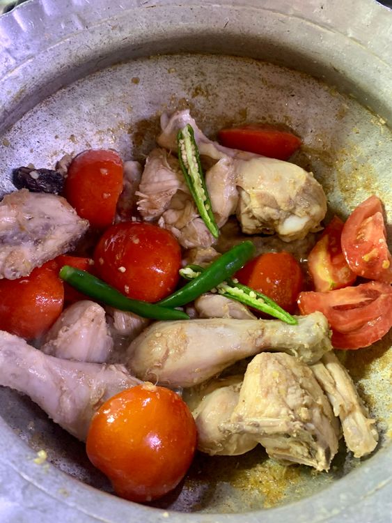 Step 1.1: Add the tomatoes and green chillies and stir to combine