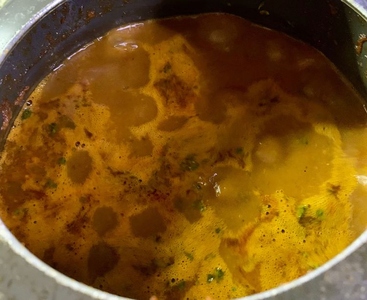 Step 1.2: Now add the remaining cooked water of the boiled beans to the cooker along with 1 cup water and add kasuri methi and bring to a boil