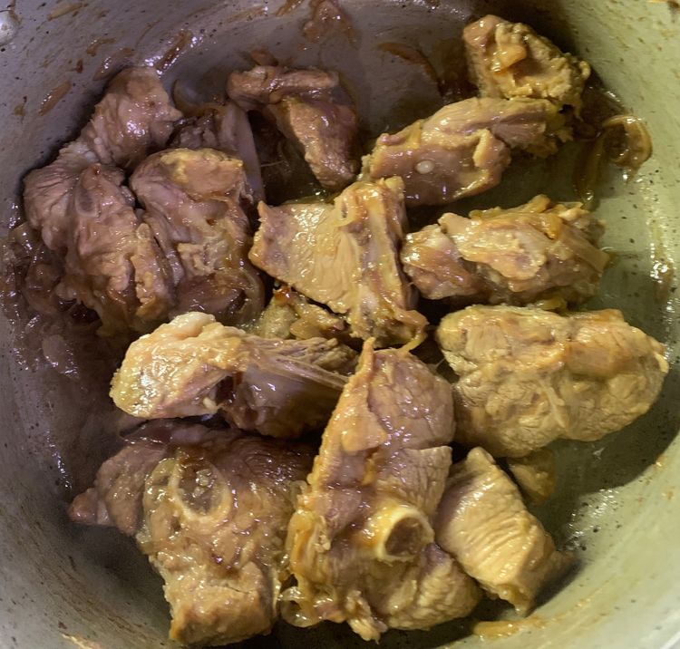 Step 1.2: Add the marinated pieces of mutton and sauté for 7-8 minutes until lightly golden on all sides
