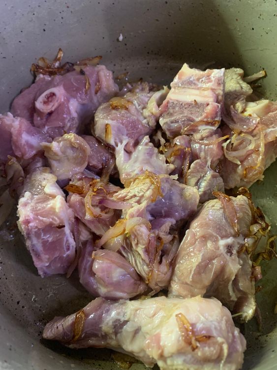 Step 1.1: Add the marinated pieces of mutton and sauté for 7-8 minutes until lightly golden on all sides