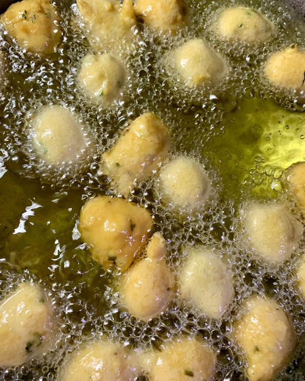 Step 1.3: Gently drop small portions of the batter into the hot oil