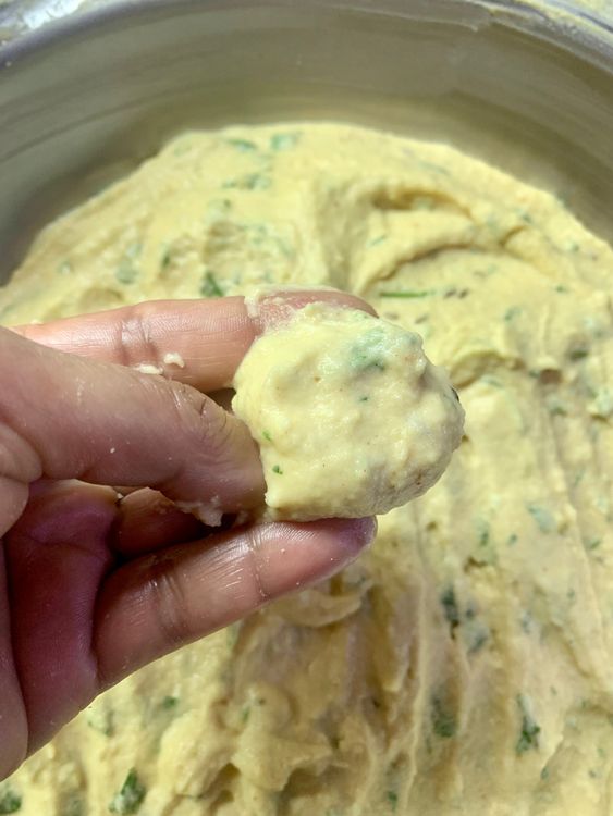 Step 1.1: Gently drop small portions of the batter into the hot oil