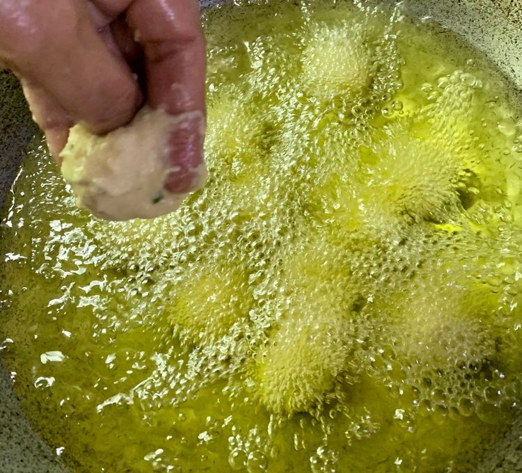 Step 1.2: Gently drop small portions of the batter into the hot oil