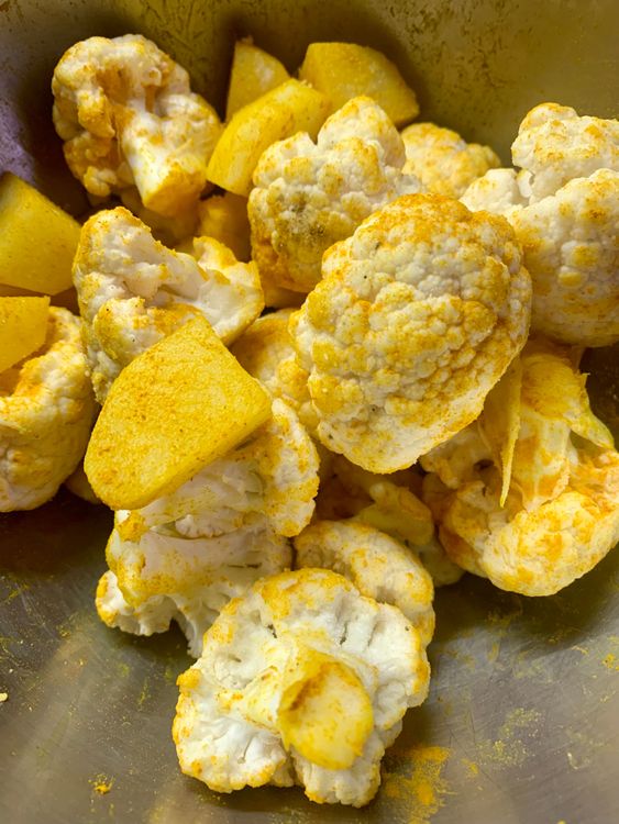 Step 2.1: Cut and wash the cauliflower florets and potatoes, pat them dry, and place them in a bowl