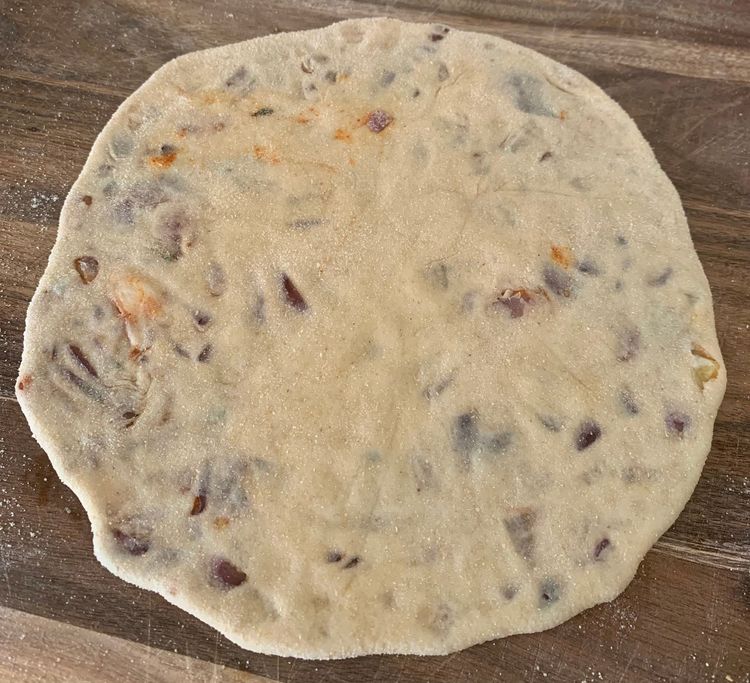 Step 2.1: Flatten the dough ball by gently pressing it between your palms