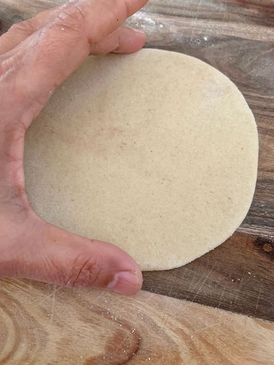 Step 2.1: Roll it with a rolling pin until it takes a round shape
